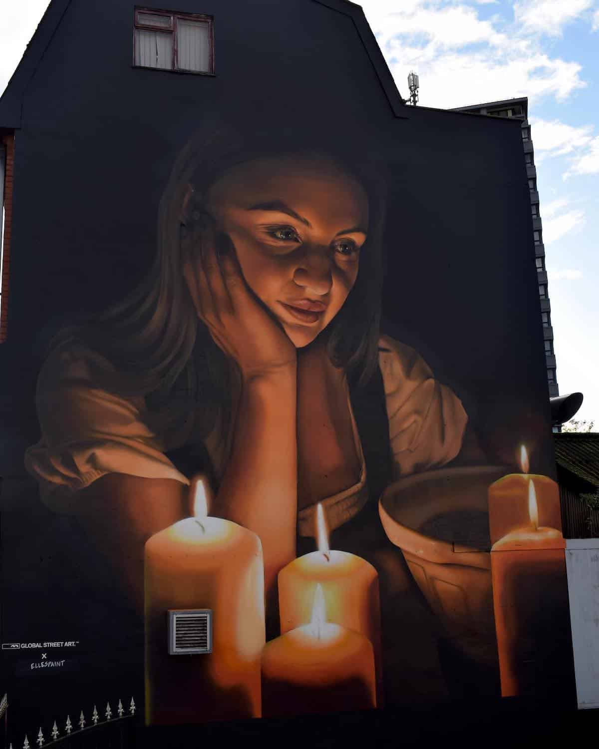 Mural of a Girl With Candles by Elle Koziupa