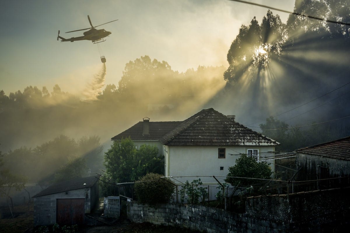 Fire helicopter in Spain dumping water on a fire